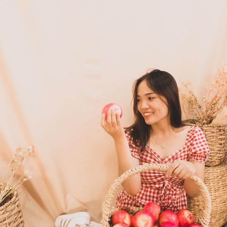 Kaveri Mehta, Lead Design Curator at Calm Harbor Quill, reviewing corporate floral arrangements